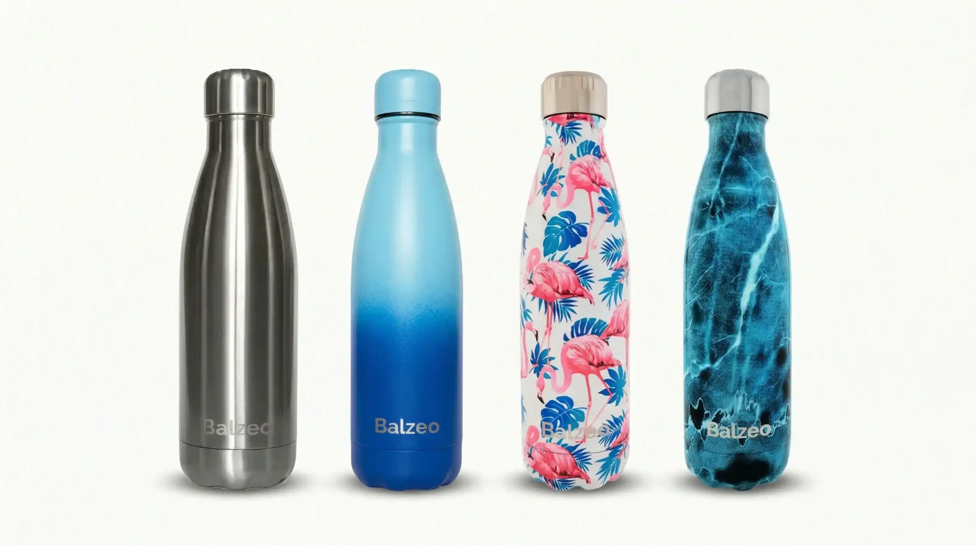 Gourde personnalisée entreprise : le guide complet 2026 2 Quatre gourdes isothermes Balzeo en différentes finitions : inox brossé, noir mat, blanc mat, bleu marine mat, sur fond blanc studio